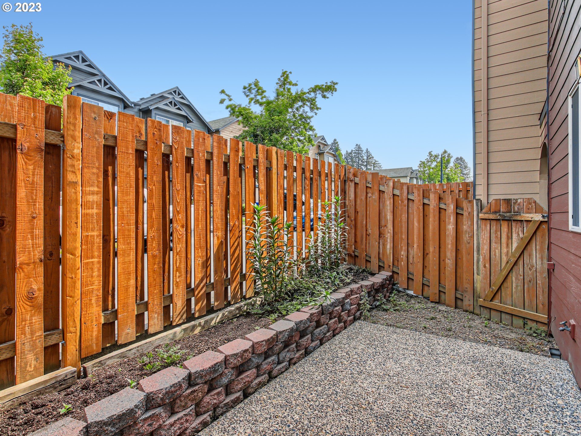 5877 Southeast 15th Drive Gresham, OR 97080 - Photo 26 of 27 a view of a backyard with wooden fence