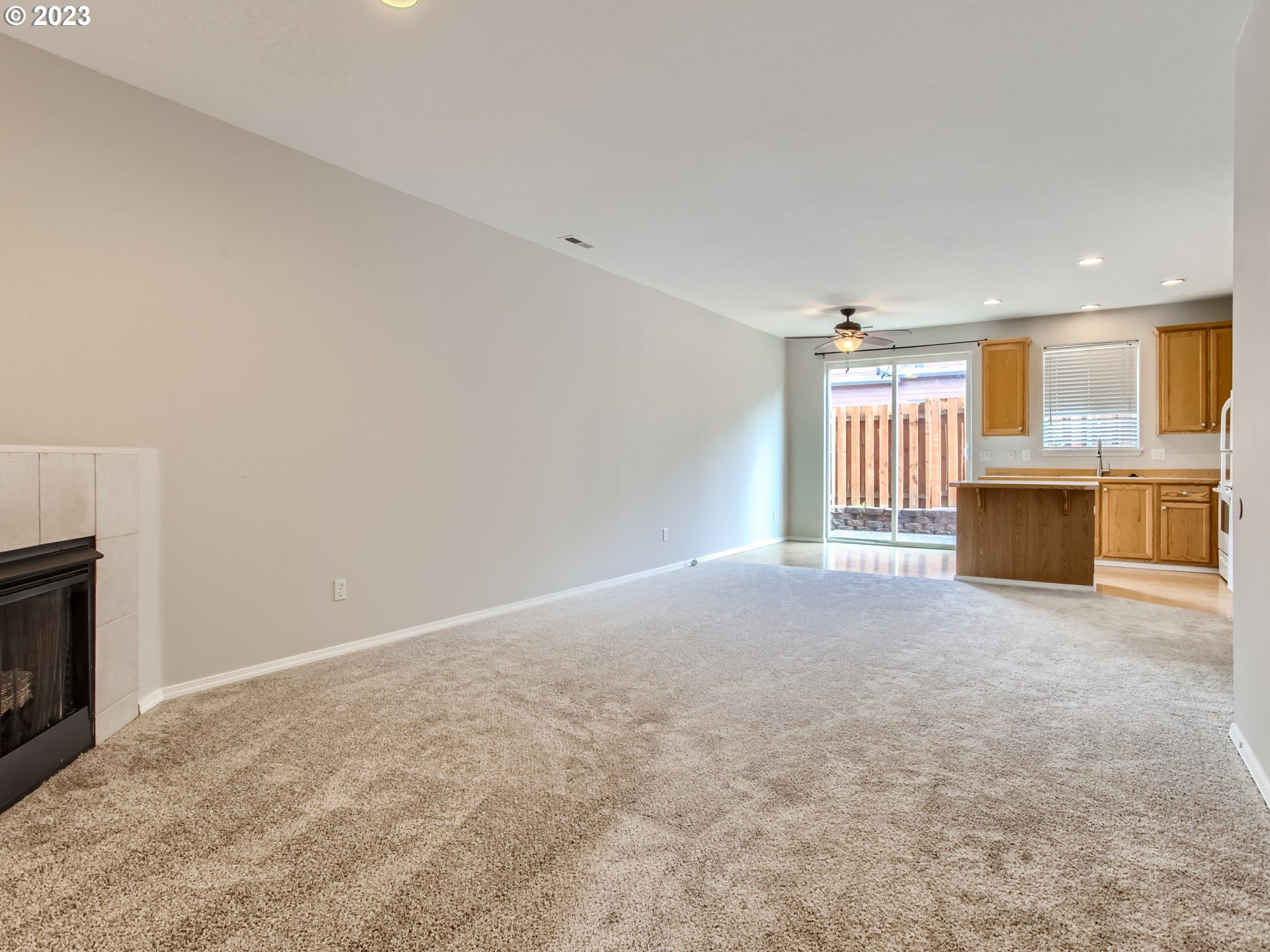 5877 Southeast 15th Drive Gresham, OR 97080 - Photo 5 of 27 a view of empty room with a fireplace and window