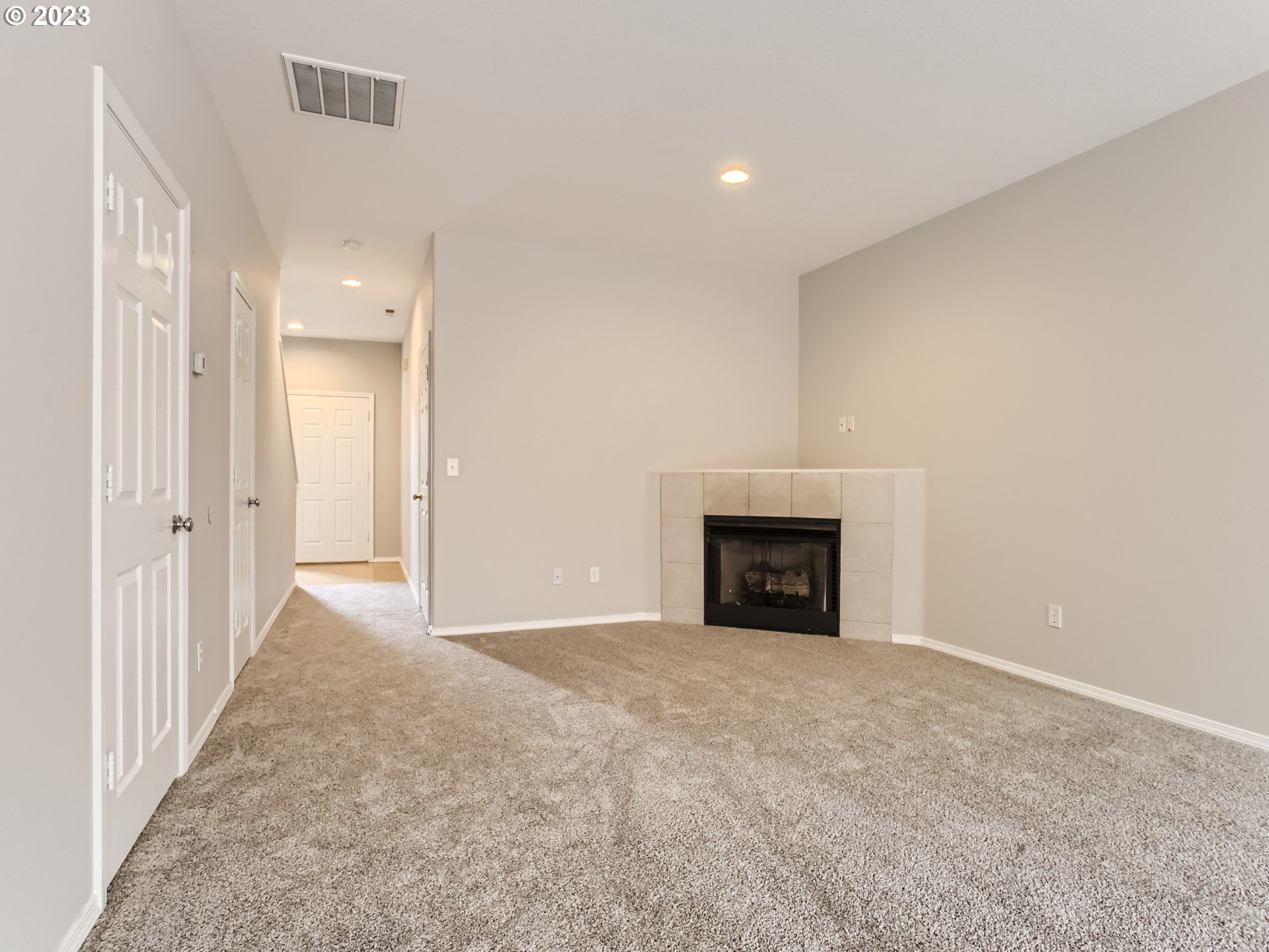 5877 Southeast 15th Drive Gresham, OR 97080 - Photo 6 of 27 a view of an empty room with a fireplace