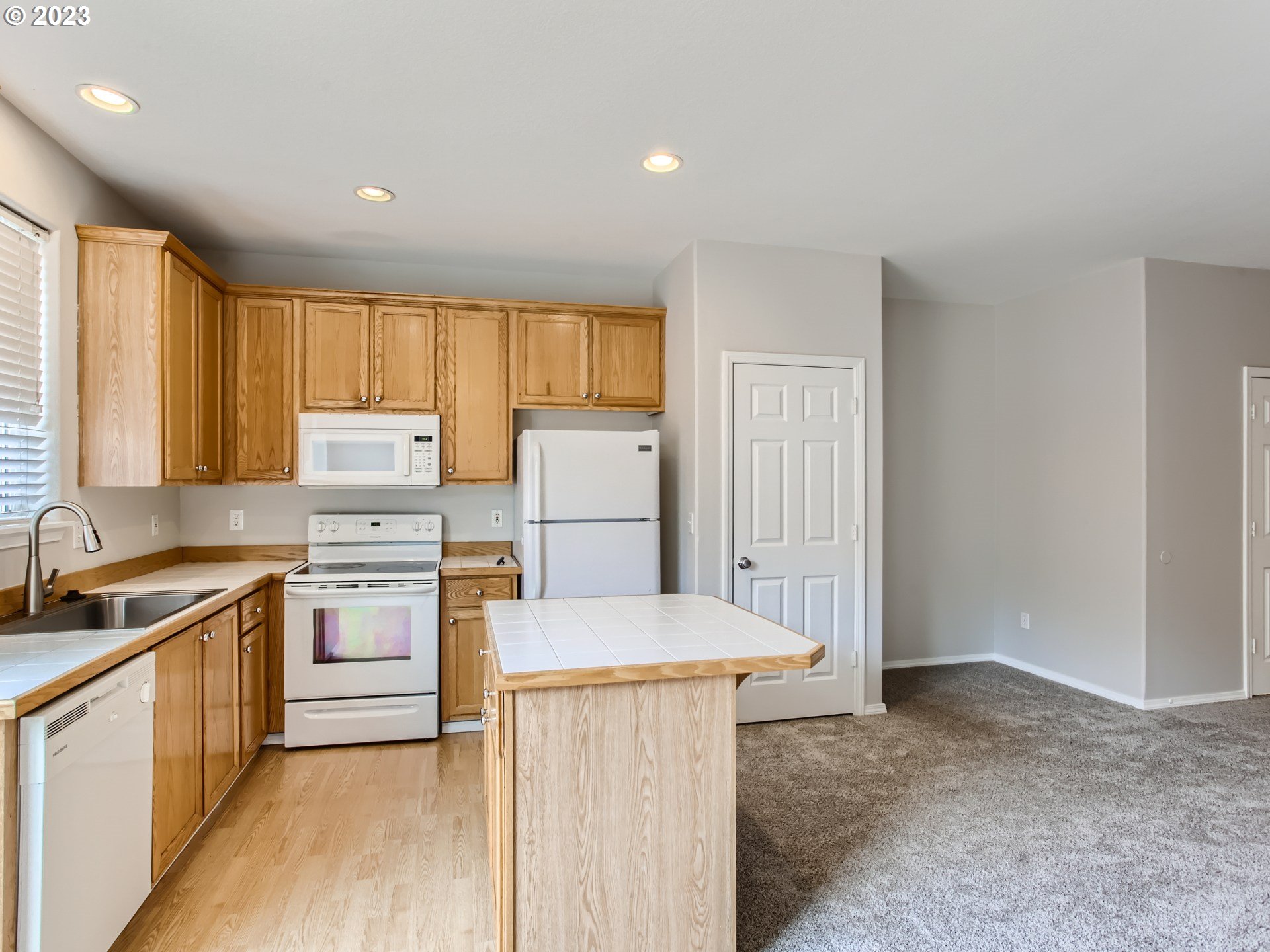5877 Southeast 15th Drive Gresham, OR 97080 - Photo 10 of 27 a kitchen that has a cabinets and a stove