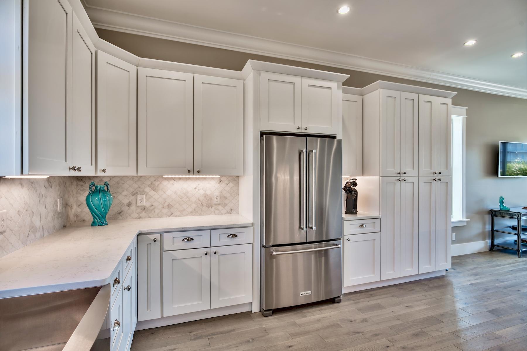 231 Rue St Tropez Miramar Beach, FL 32550 - Photo 15 of 35 a kitchen with stainless steel appliances granite countertop a refrigerator and a stove