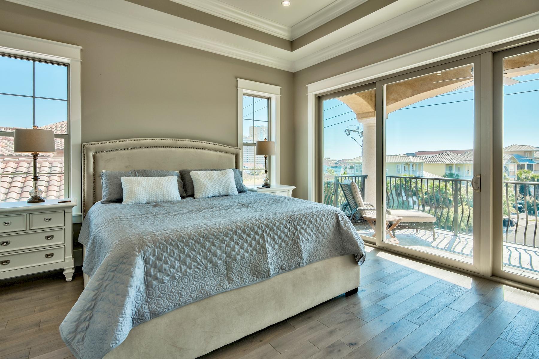 231 Rue St Tropez Miramar Beach, FL 32550 - Photo 23 of 35 a bedroom with a large bed and a large window