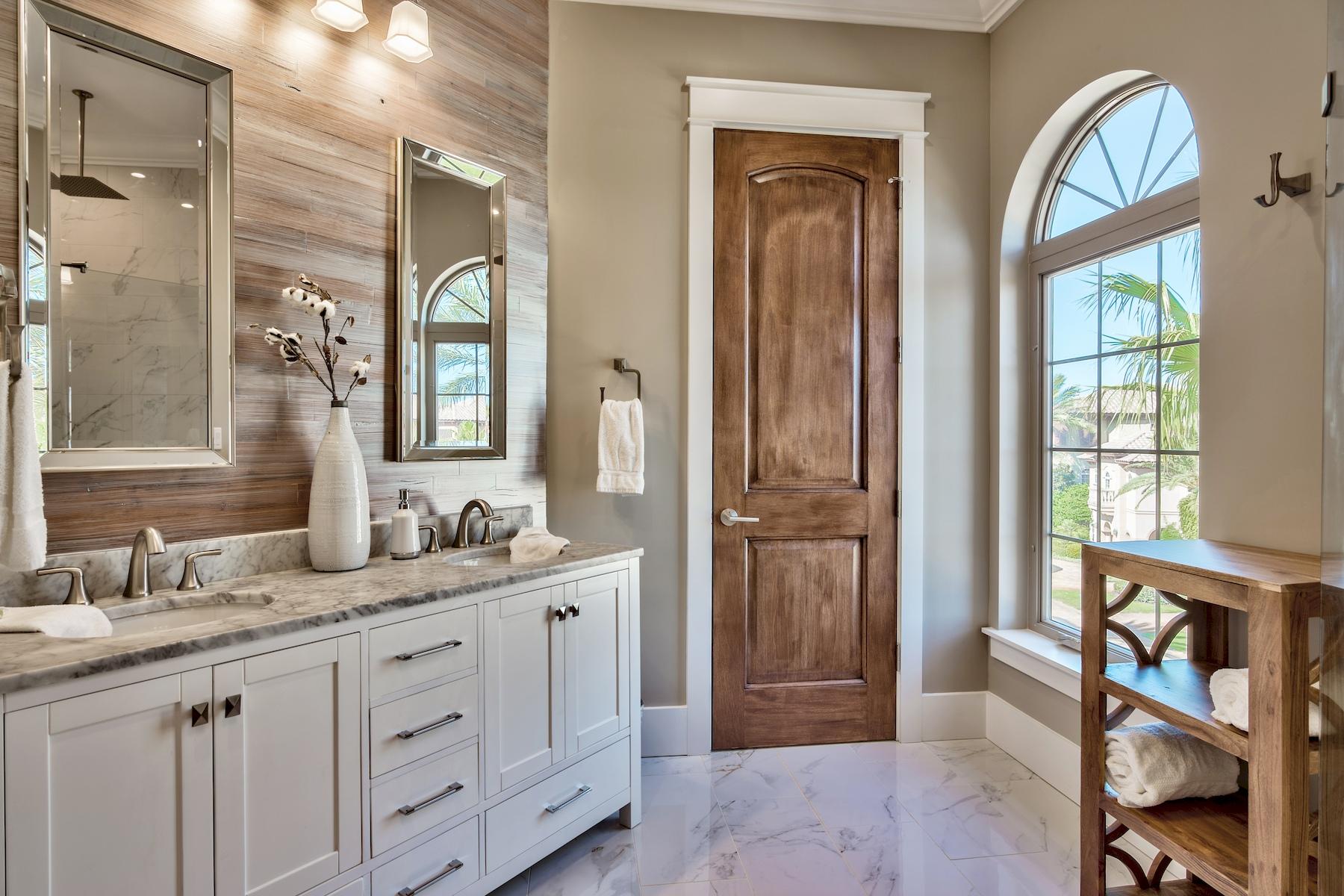231 Rue St Tropez Miramar Beach, FL 32550 - Photo 29 of 35 a bathroom with a granite countertop sink mirror and a bathtub