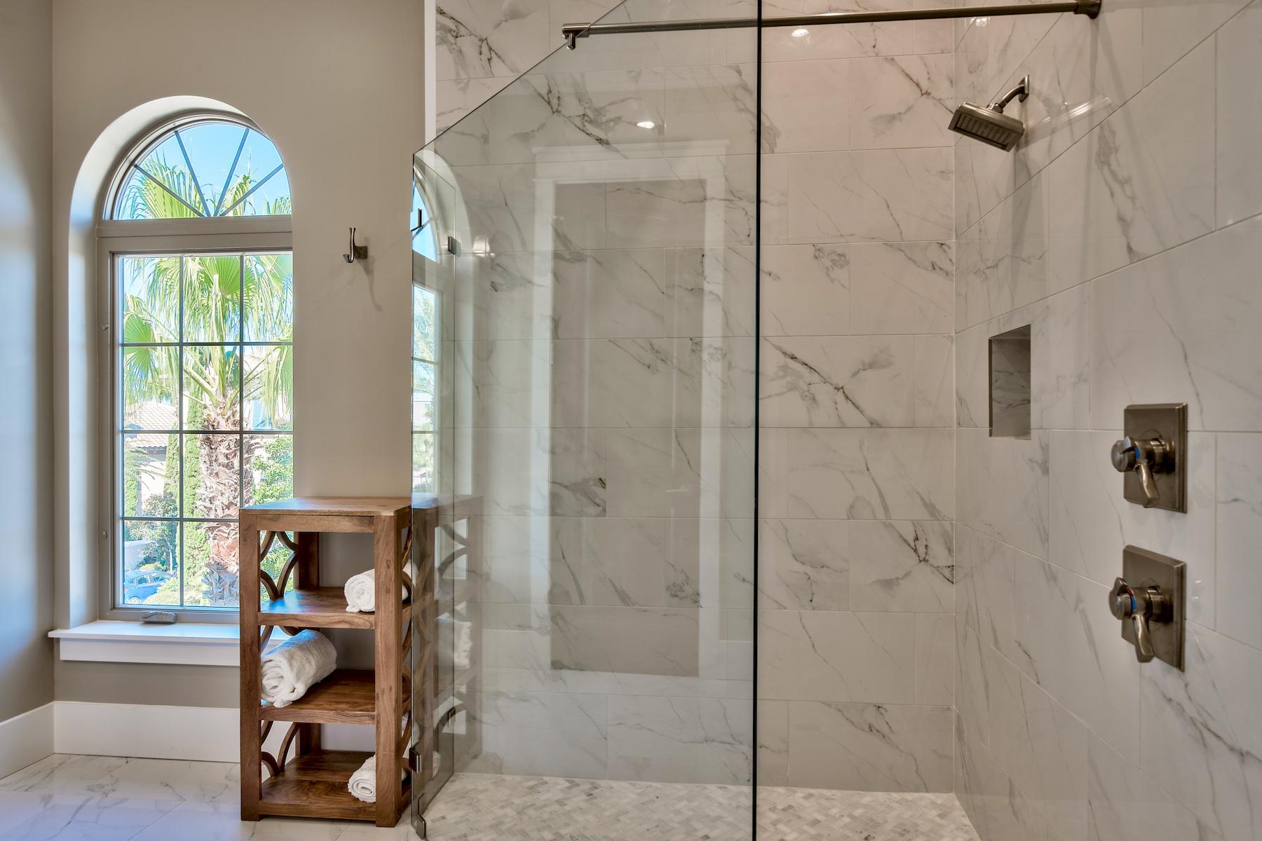 231 Rue St Tropez Miramar Beach, FL 32550 - Photo 30 of 35 a view of a bathroom with a tub shower and a window