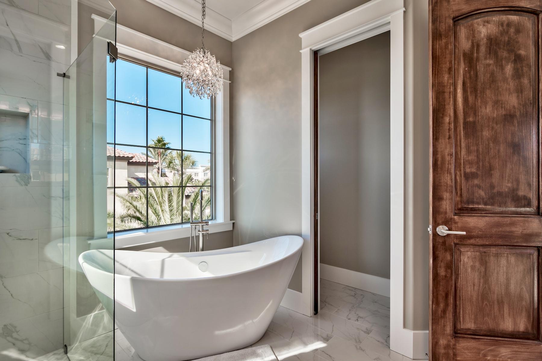 231 Rue St Tropez Miramar Beach, FL 32550 - Photo 6 of 35 a white bath tub sitting in a bathroom next to a window