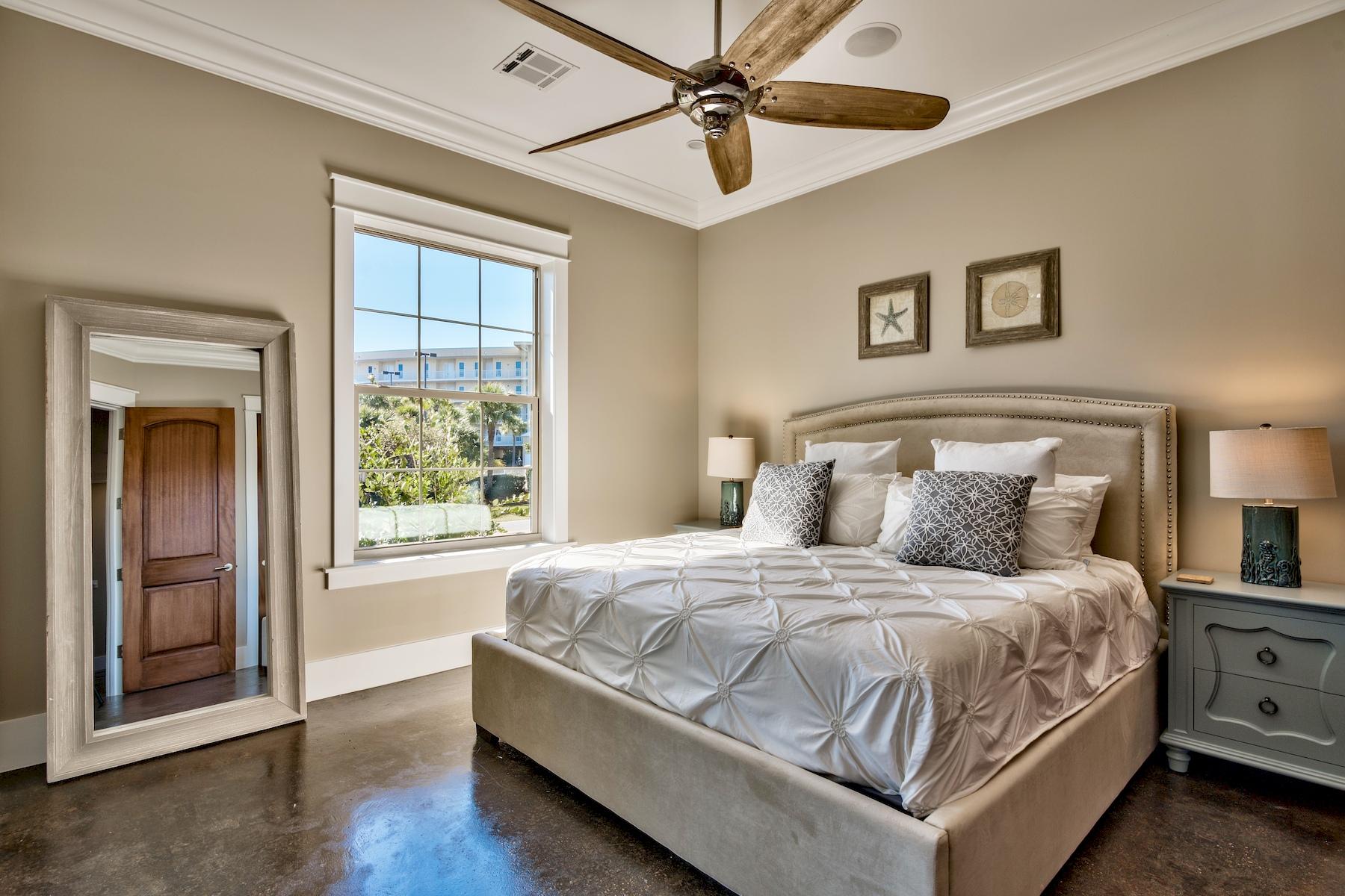 231 Rue St Tropez Miramar Beach, FL 32550 - Photo 10 of 35 a bedroom with a large bed and a chandelier
