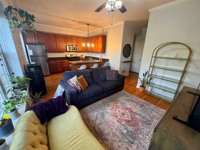 a living room with furniture bathtub and a chandelier