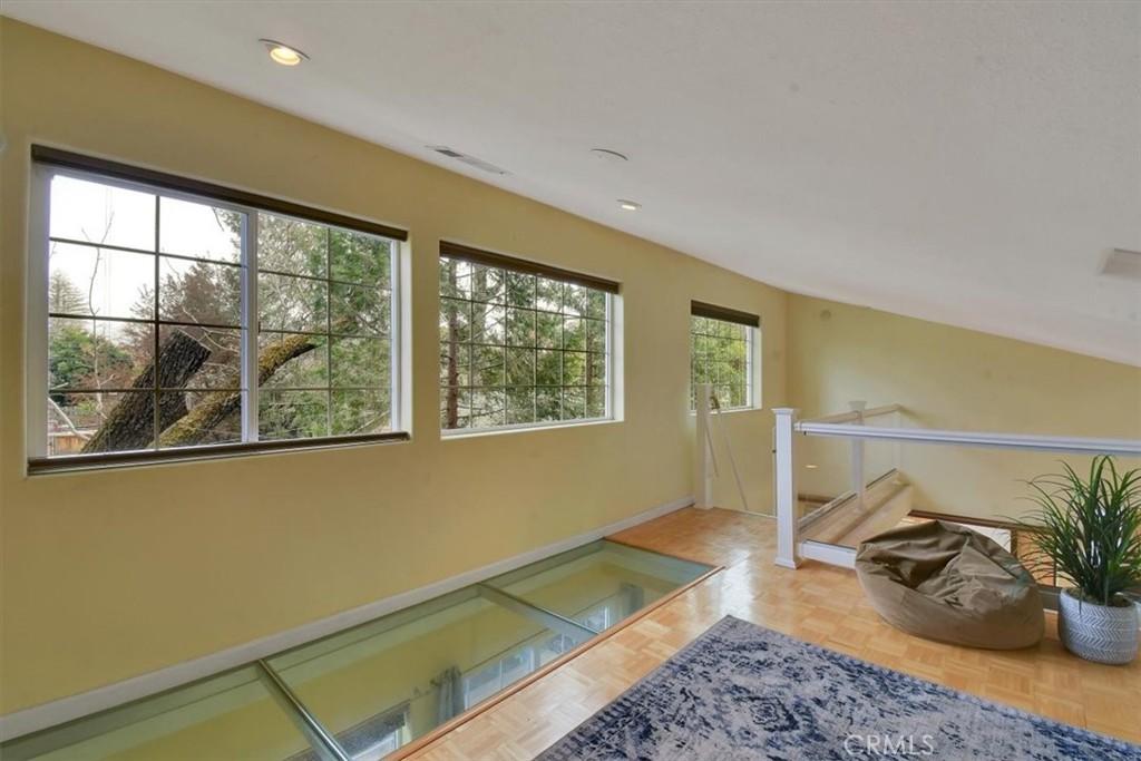 1631 Salem Street Chico, CA 95928 - Photo 24 of 71 a room with a couch and a potted plant