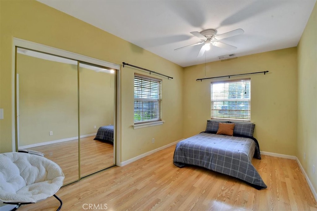 1631 Salem Street Chico, CA 95928 - Photo 26 of 71 a bedroom with a bed and glass door