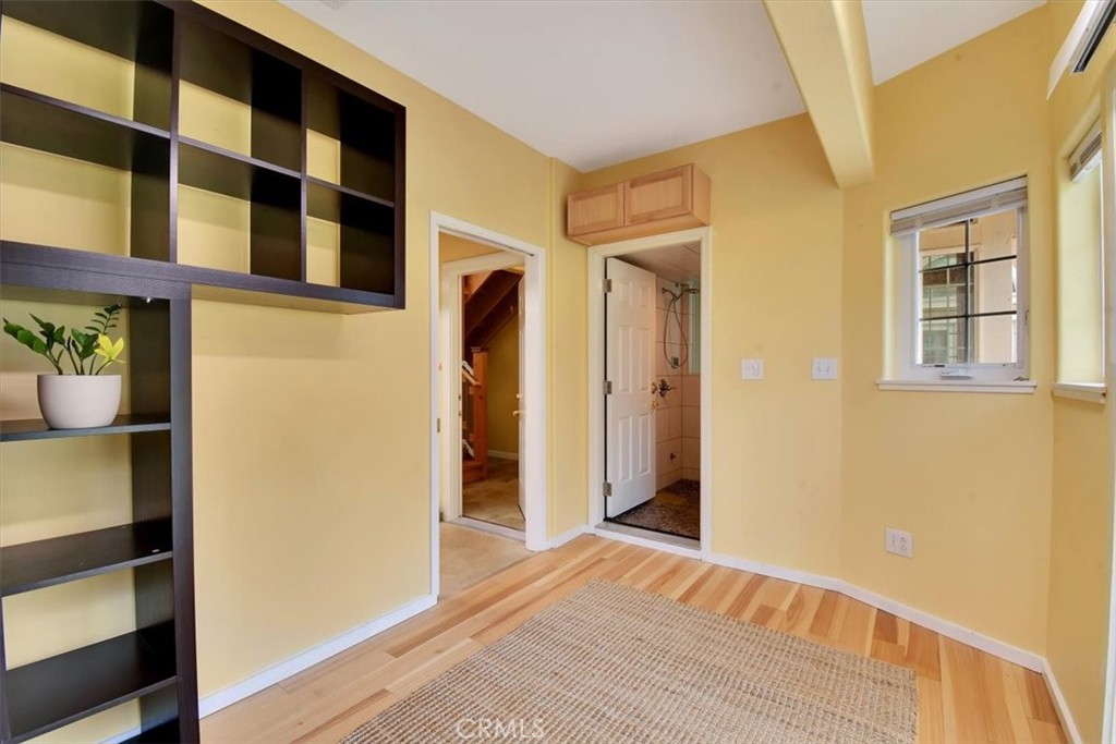 1631 Salem Street Chico, CA 95928 - Photo 51 of 71 a view of a bedroom with wooden floor and a window