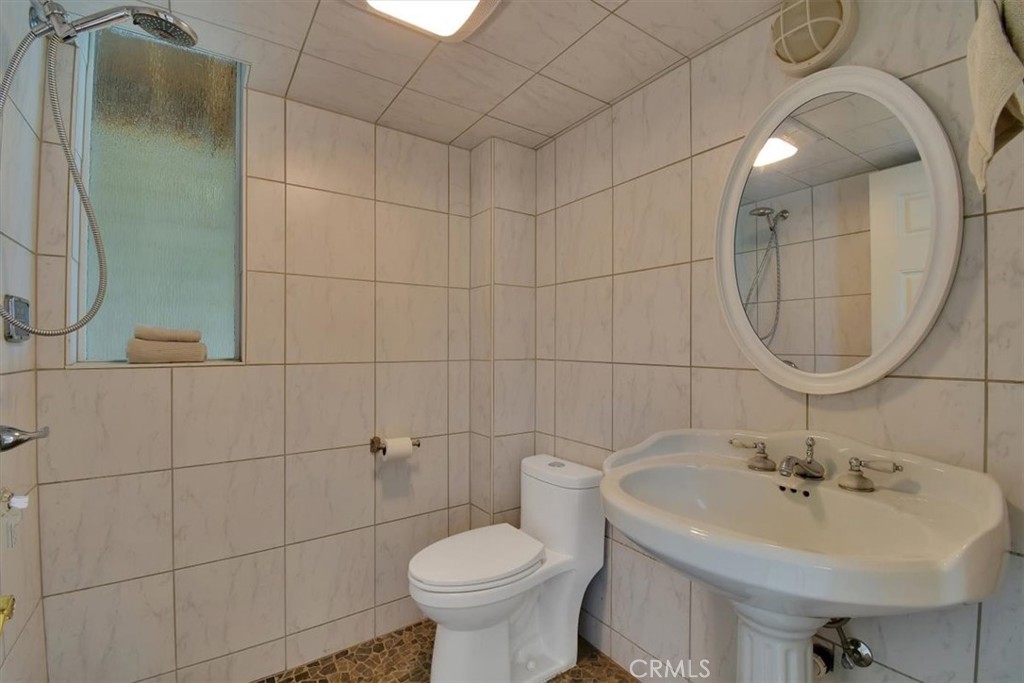 1631 Salem Street Chico, CA 95928 - Photo 52 of 71 a bathroom with a sink toilet and a mirror