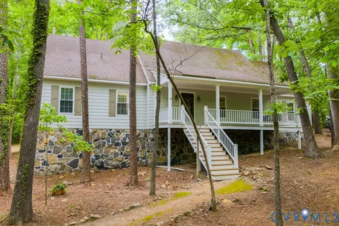 a front view of a house with a yard balcony