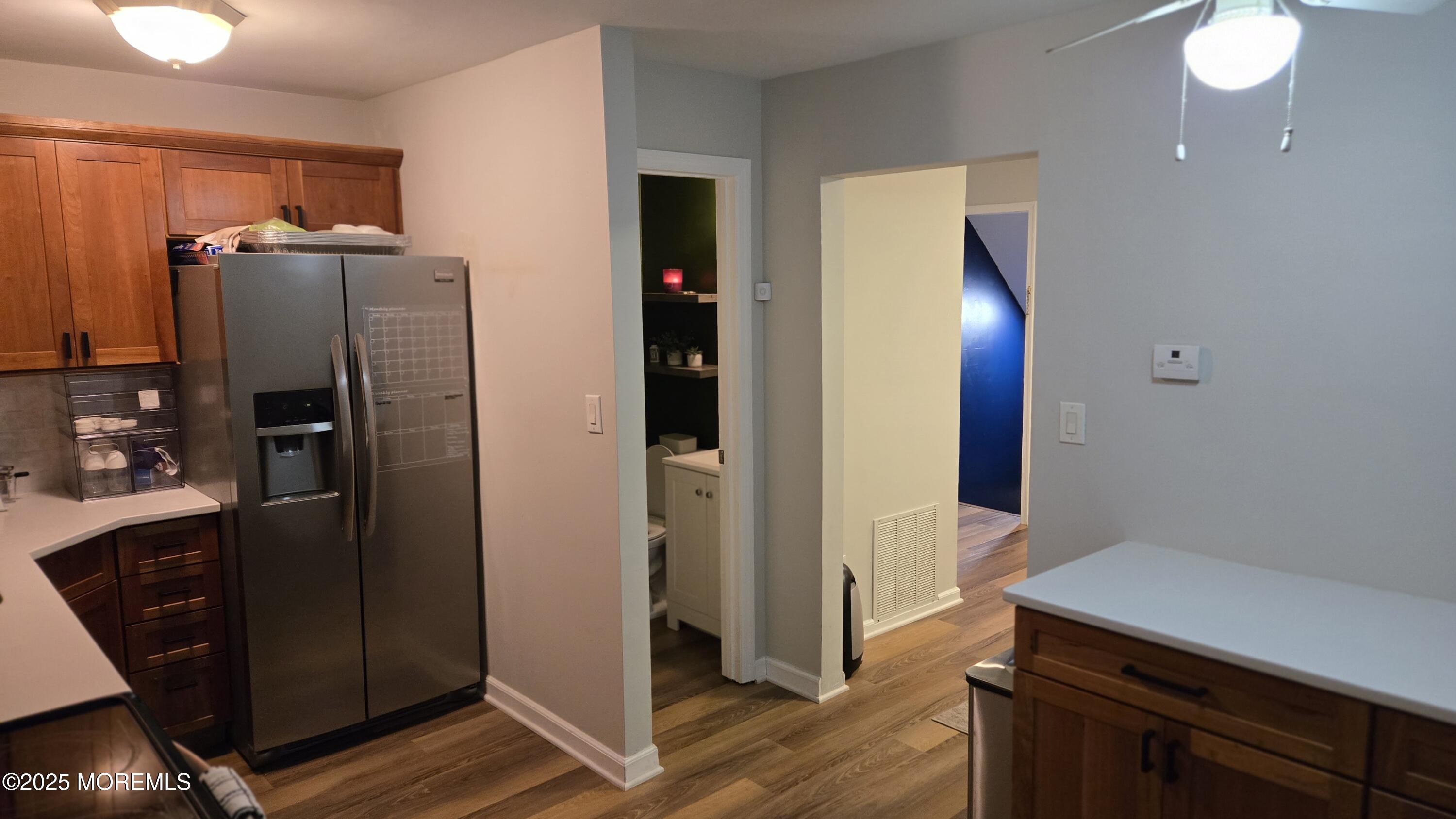 3 Primrose Lane Brick, NJ 08724 - Photo 3 of 8 a kitchen with stainless steel appliances a refrigerator and wooden floor