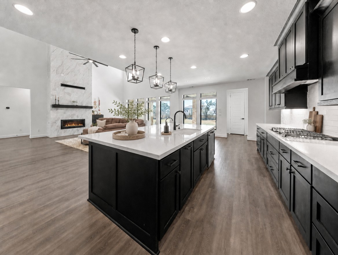 1440 Riva Ridge Drive Leander, TX 78641 - Photo 7 of 37 An open concept design seamlessly connects the sleek, well-appointed kitchen with the spacious living area.