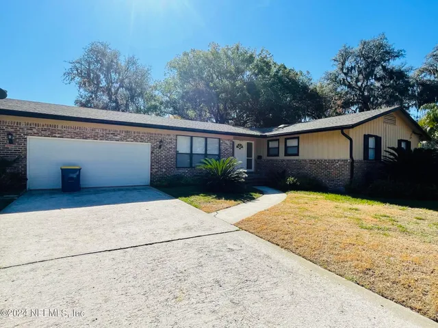 a house with trees in the background