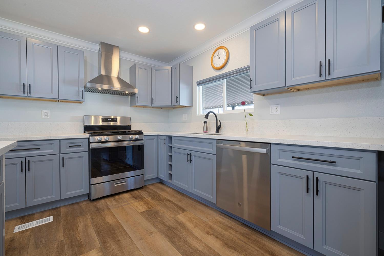 1330 Calaveritas Road, Unit 25 San Andreas, CA 95249 - Photo 11 of 43 a kitchen with cabinets stainless steel appliances and wooden floor