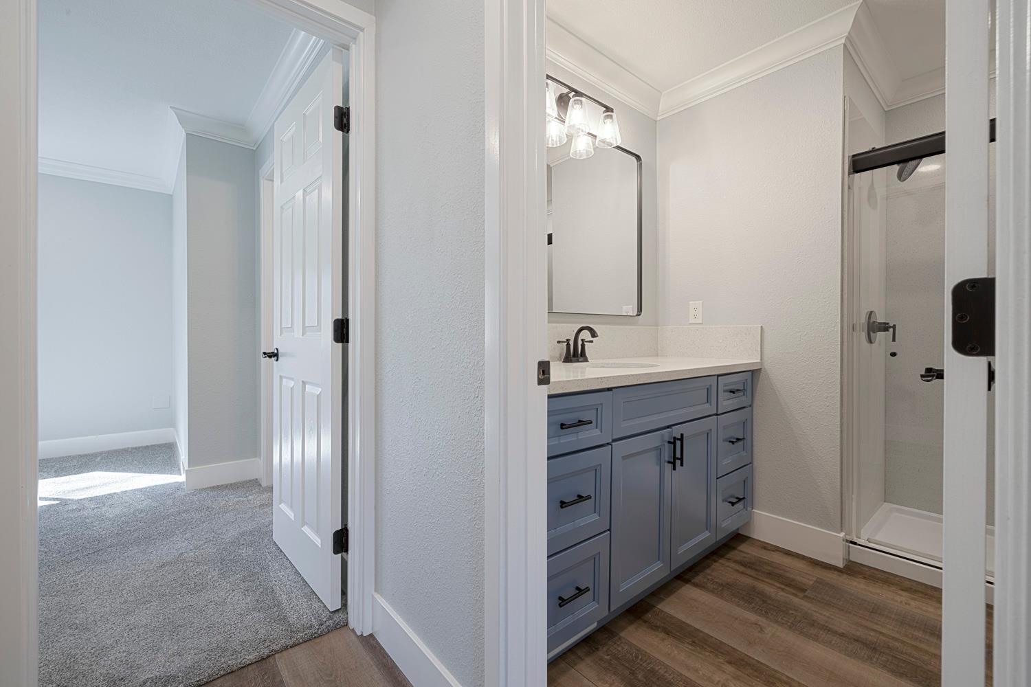 1330 Calaveritas Road, Unit 25 San Andreas, CA 95249 - Photo 21 of 43 a bathroom with a double vanity sink and mirror