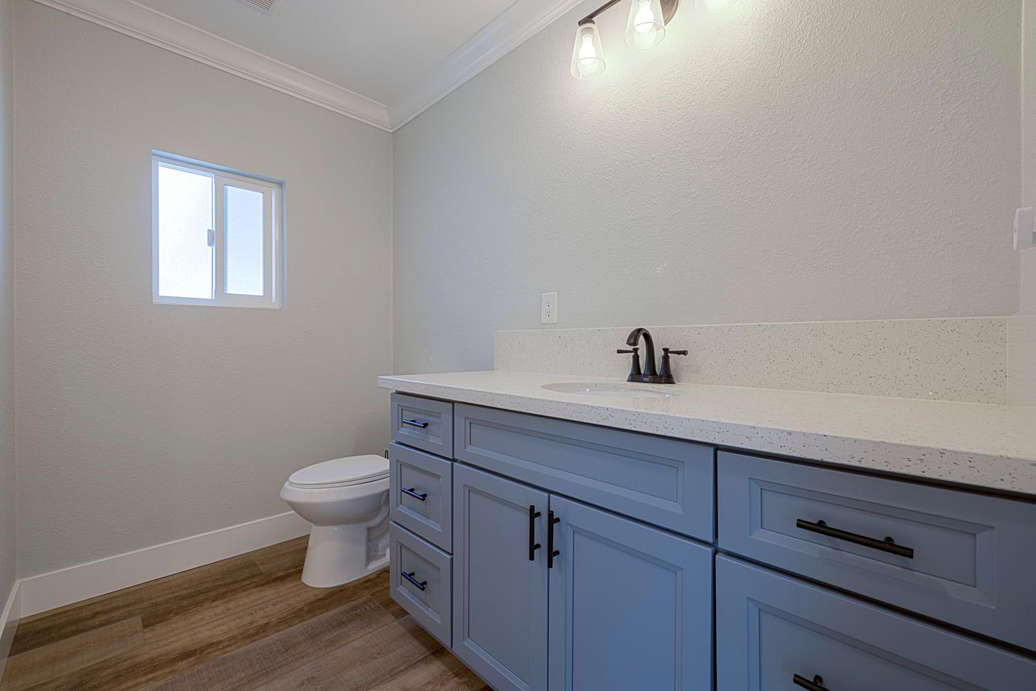 1330 Calaveritas Road, Unit 25 San Andreas, CA 95249 - Photo 24 of 43 a bathroom with a sink a toilet and a mirror
