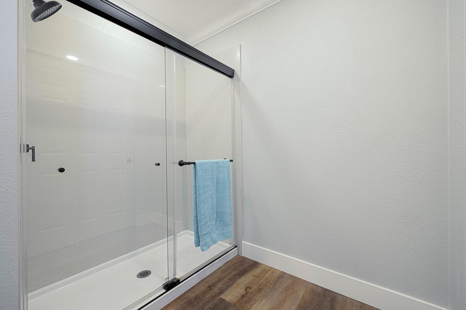1330 Calaveritas Road, Unit 25 San Andreas, CA 95249 - Photo 25 of 43 a bathroom with a glass shower door