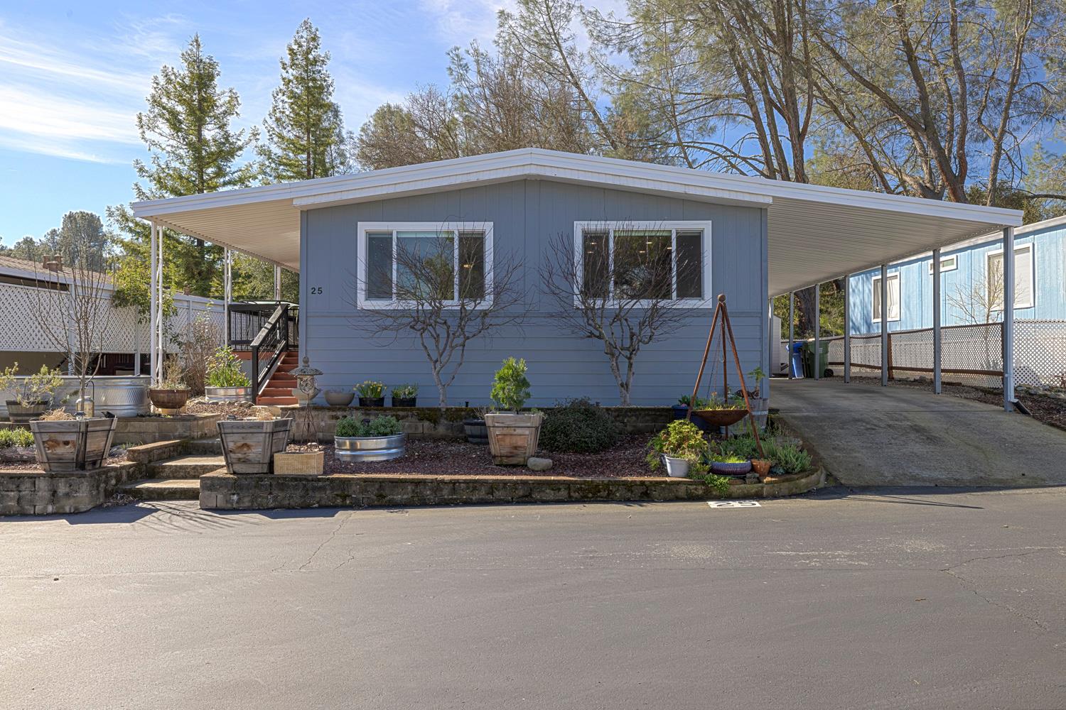 1330 Calaveritas Road, Unit 25 San Andreas, CA 95249 - Photo 3 of 43 a front view of a house with a yard and outdoor seating