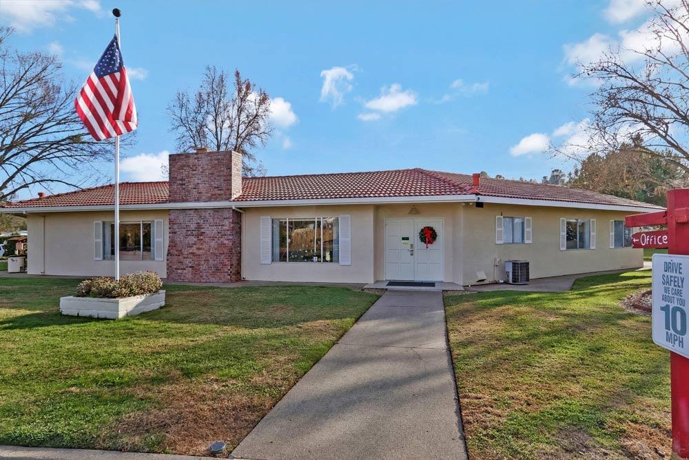 1330 Calaveritas Road, Unit 25 San Andreas, CA 95249 - Photo 32 of 43 a front view of a house with a yard and garage