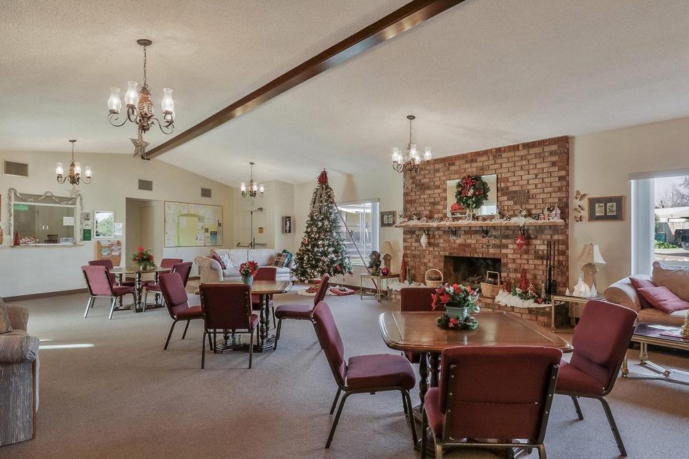 1330 Calaveritas Road, Unit 25 San Andreas, CA 95249 - Photo 34 of 43 a living room with furniture a fireplace and a chandelier