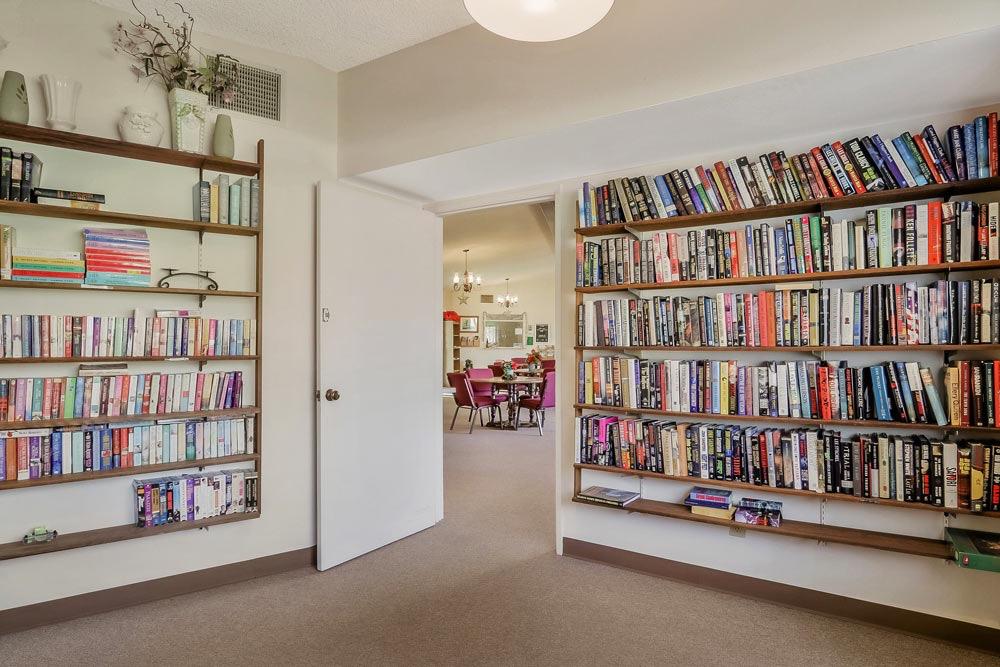 1330 Calaveritas Road, Unit 25 San Andreas, CA 95249 - Photo 36 of 43 a room with lots of books and a book shelf