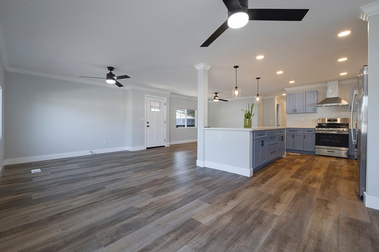 1330 Calaveritas Road, Unit 25 San Andreas, CA 95249 - Photo 10 of 43 a view of kitchen with kitchen island microwave and wooden floor