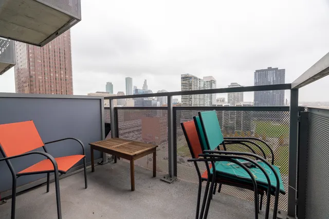 a view of a chairs and table in the balcony