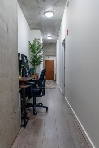 a view of a workspace with furniture