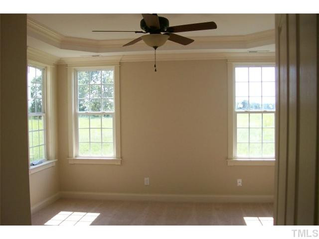 84 South Sunset Ridge Drive Willow Spring, NC 27592 - Photo 11 of 21 a view of an empty room with a window