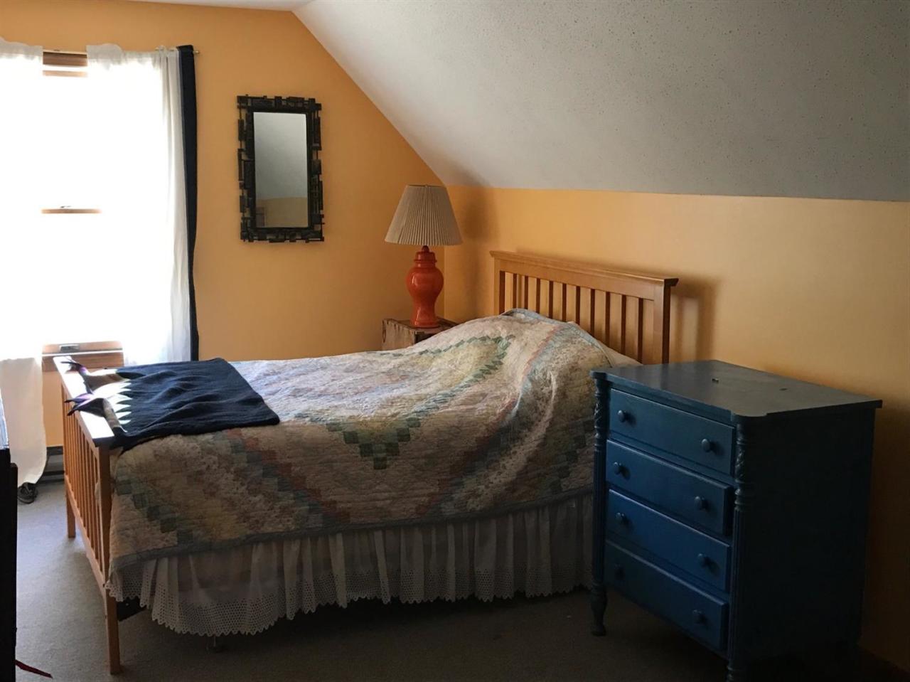 1 Depot Road Truro, MA 02666 - Photo 5 of 8 a bedroom with a bed and cabinets