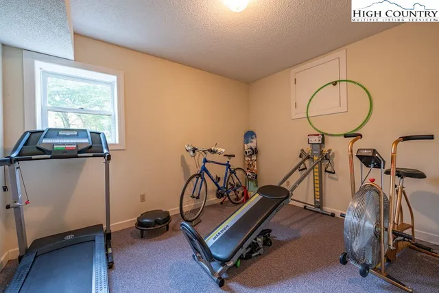 a bedroom with a bed and a night stand