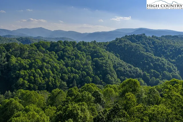 a view of a town with mountains in the background