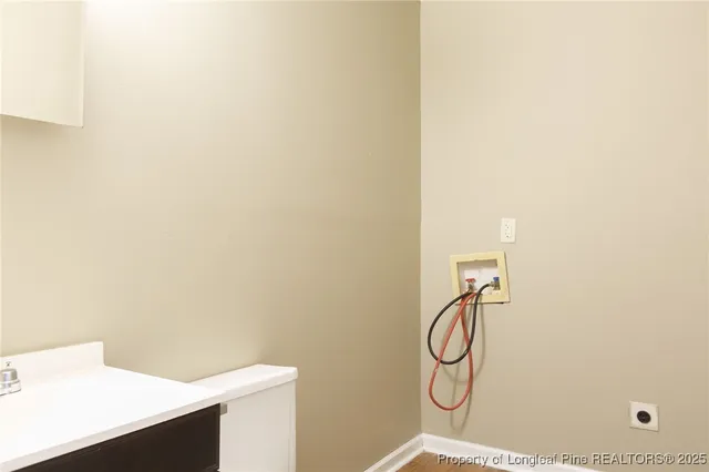 a bathroom with a granite countertop shower and a sink