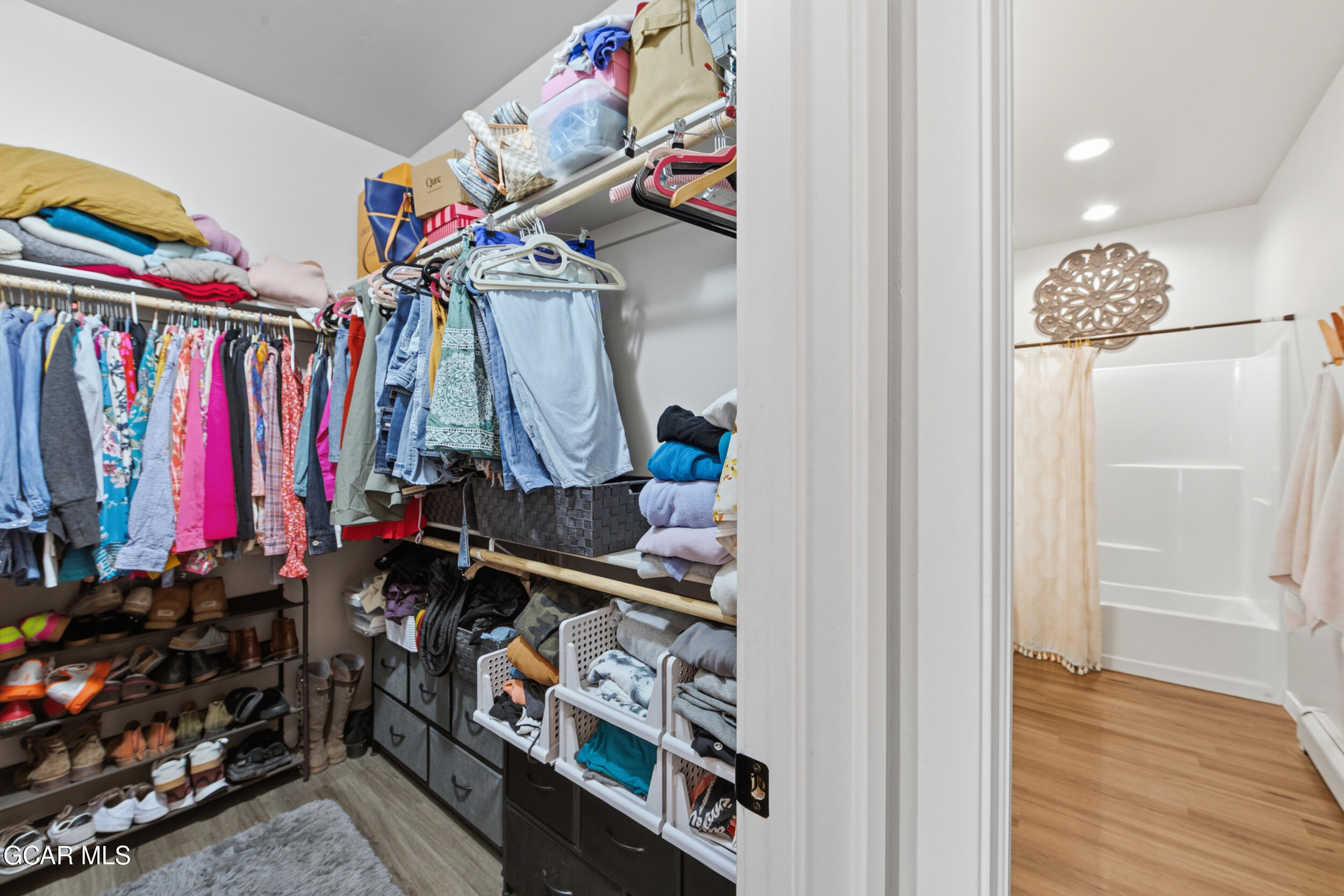 503 12th Street, Unit B Kremmling, CO 80459 - Photo 17 of 44 a view of walk in closet with clothes and shoes