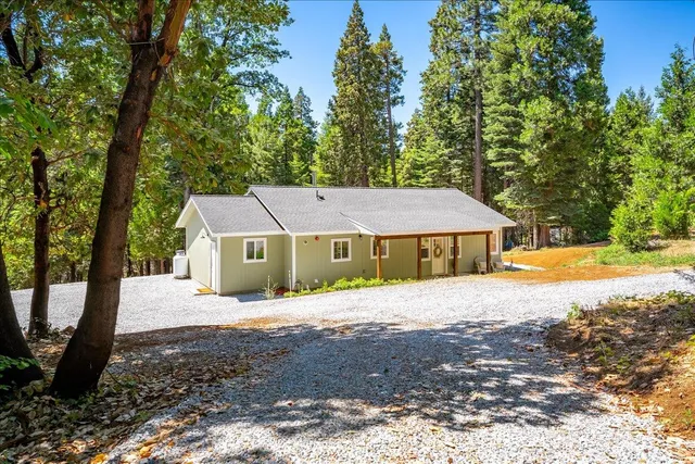 a house view with a garden space