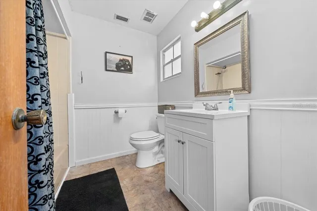 a bathroom with a bathtub and shower