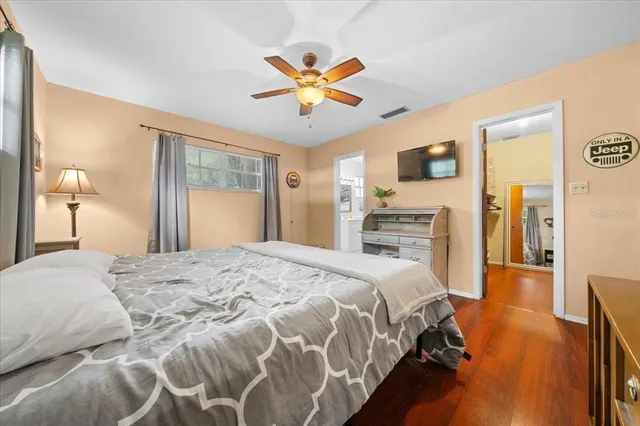 a view of walk in closet with wooden floor