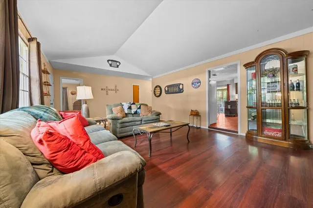 a kitchen with stainless steel appliances a stove a refrigerator and a microwave