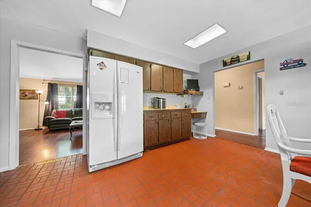 a kitchen with cabinets a sink and appliances