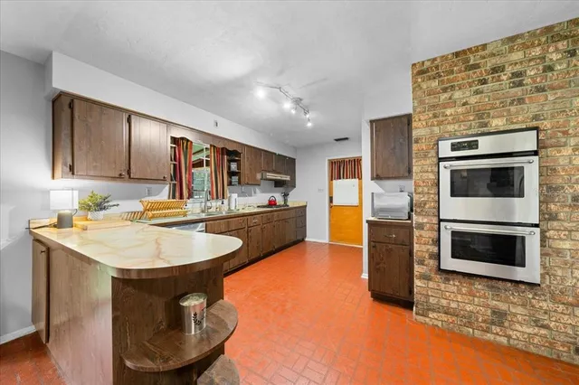 a bedroom with furniture and a large mirror