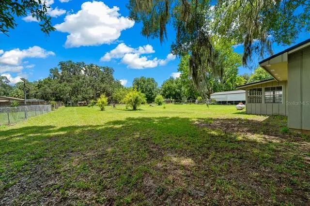 a view of a garden with a building