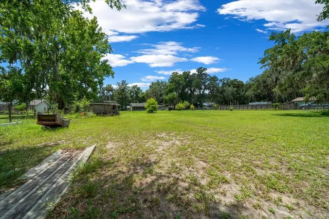 an aerial view of residential house with outdoor space