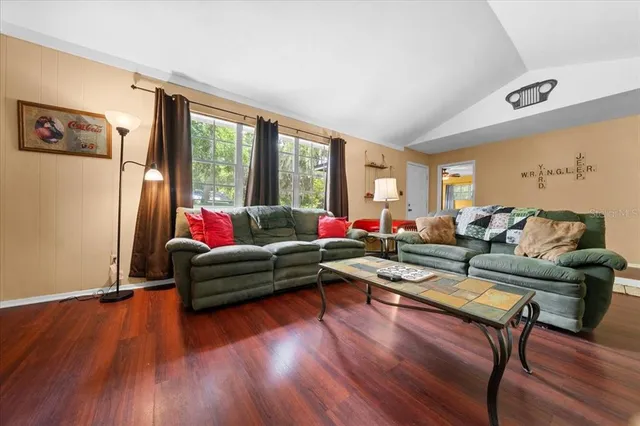 a living room with furniture flat screen tv and a fireplace