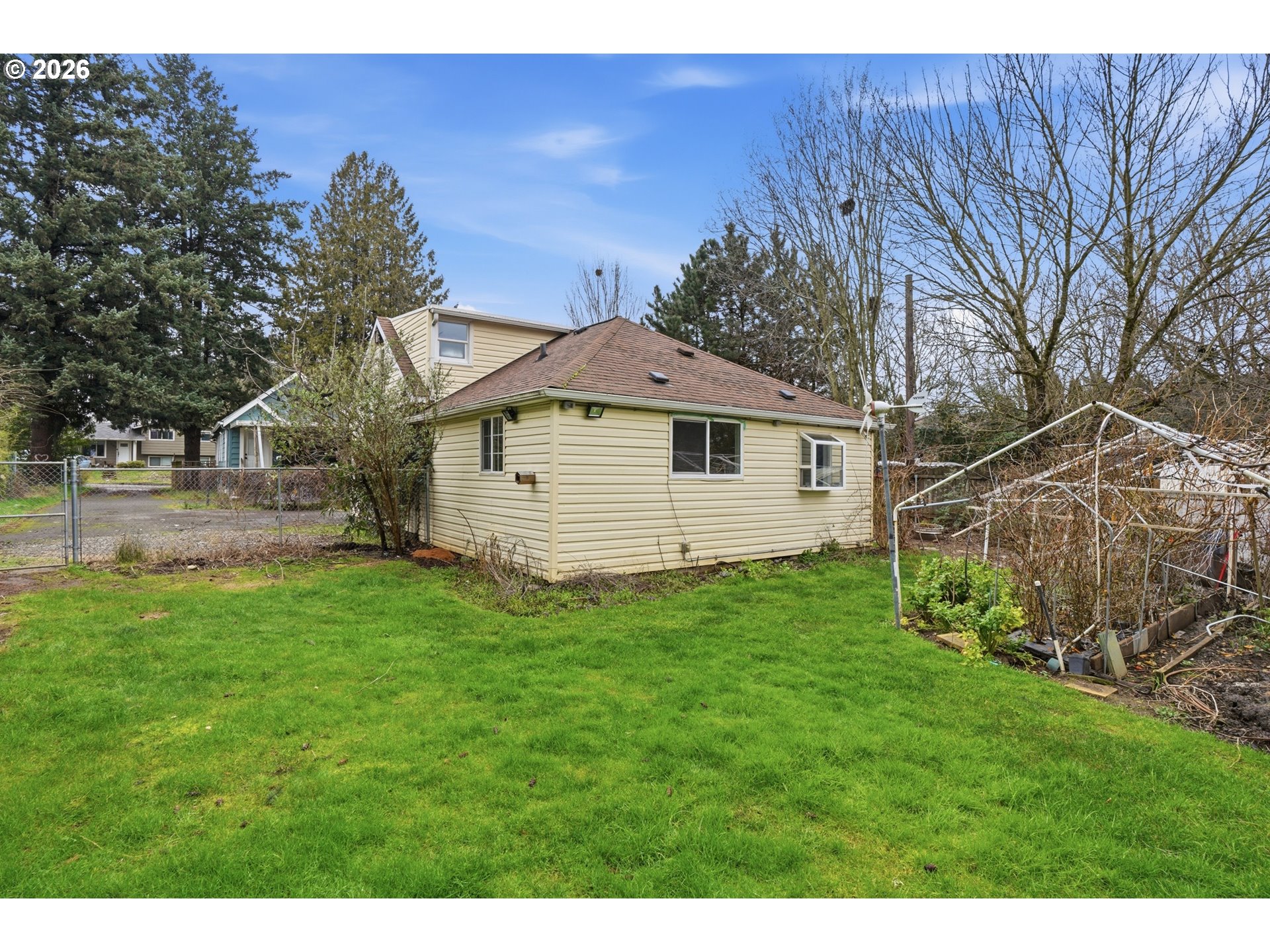 40 Southeast 133rd Avenue, Unit B Portland, OR 97233 - Photo 22 of 24 a view of a backyard with plants and large trees