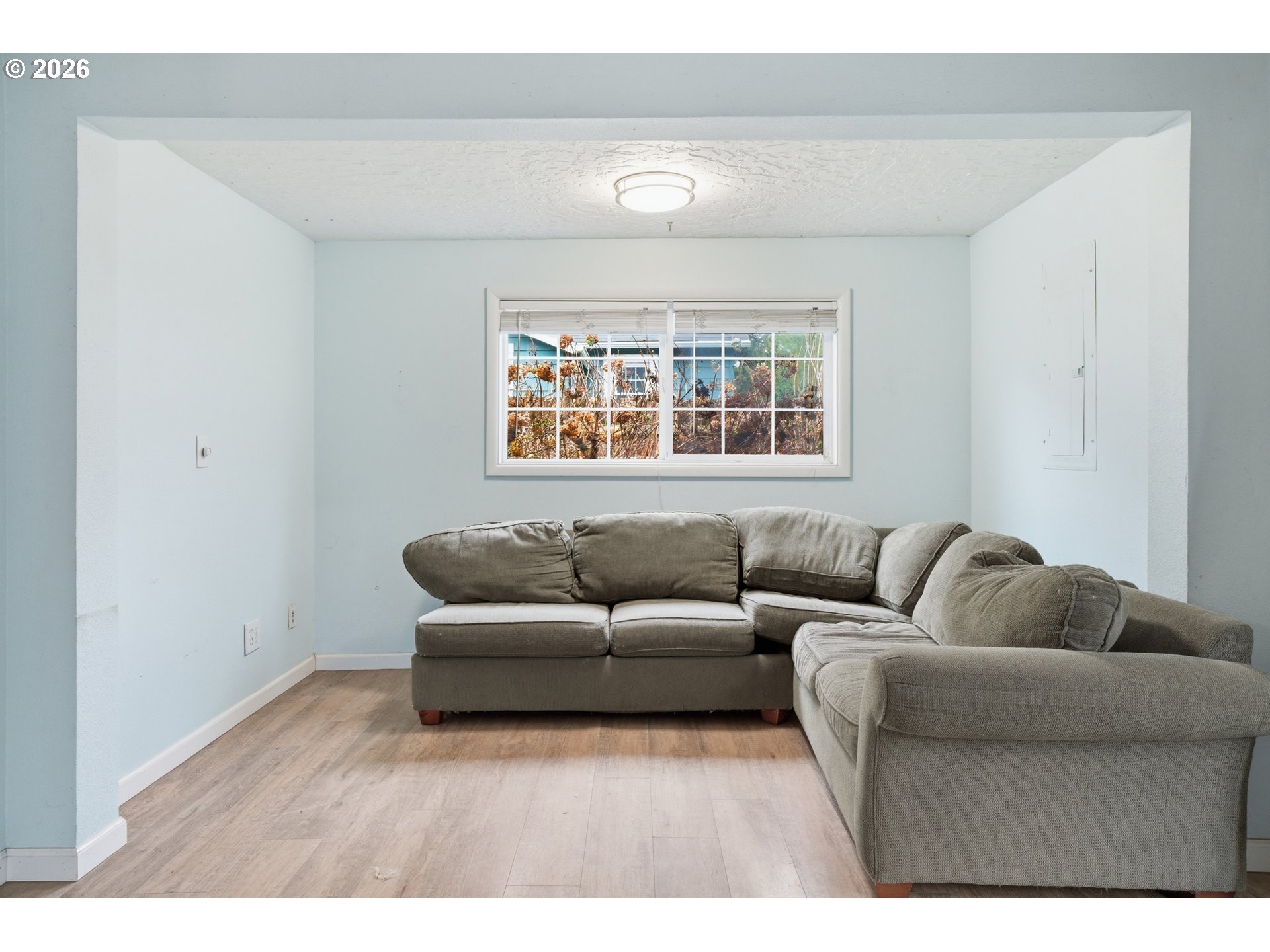 40 Southeast 133rd Avenue, Unit B Portland, OR 97233 - Photo 5 of 24 a living room with furniture and a window