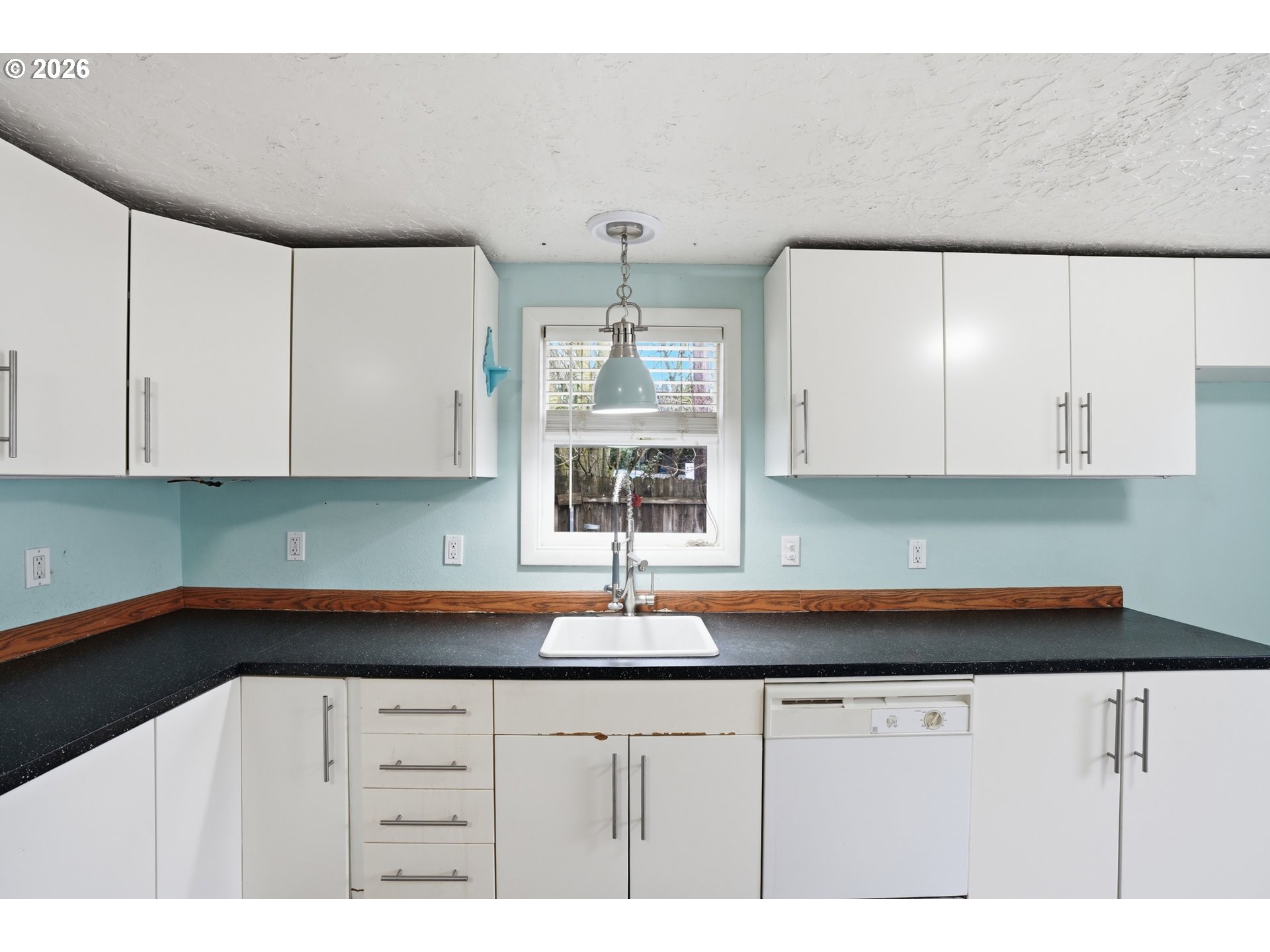 40 Southeast 133rd Avenue, Unit B Portland, OR 97233 - Photo 10 of 24 a kitchen with cabinets appliances and a sink