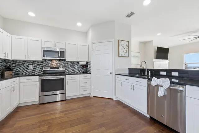 a view of entryway with wooden floor