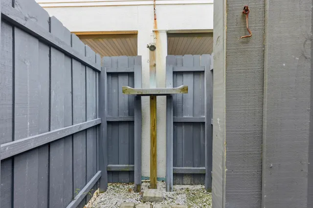 a picture of a bench in front of a white house